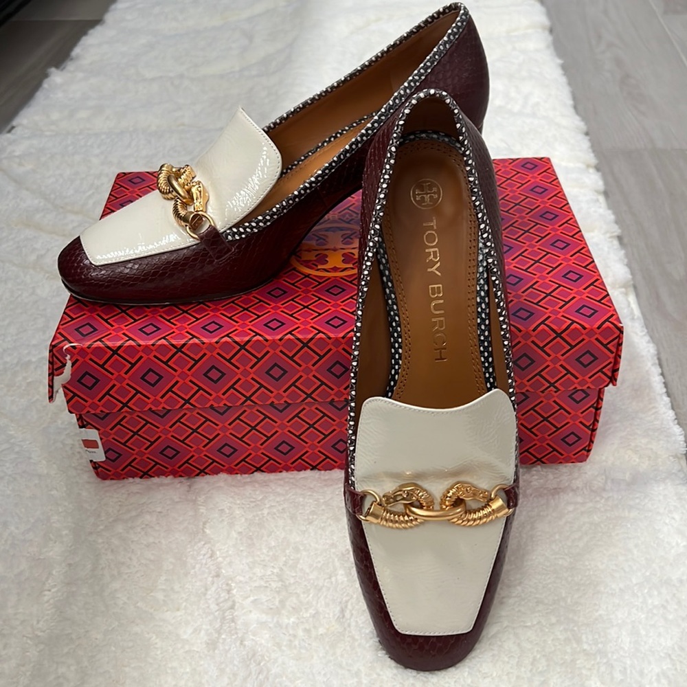 Tory Burch pump/embossed snake leather in burgundy, with a gold tone buckle.